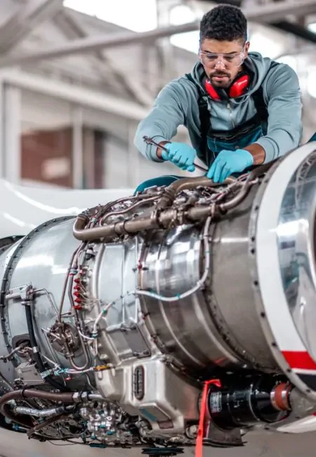 man wearing cut resistant gloves handling stock