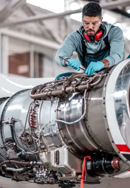 man wearing cut resistant gloves handling stock
